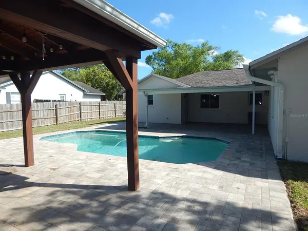 a view of backyard with green space