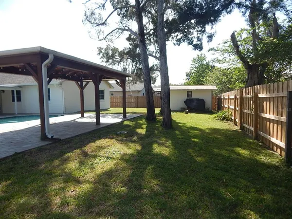 a view of a garden with a patio