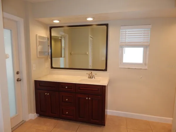 a bathroom with a sink and a mirror