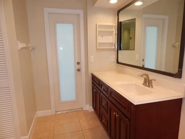 a bathroom with a sink and a mirror