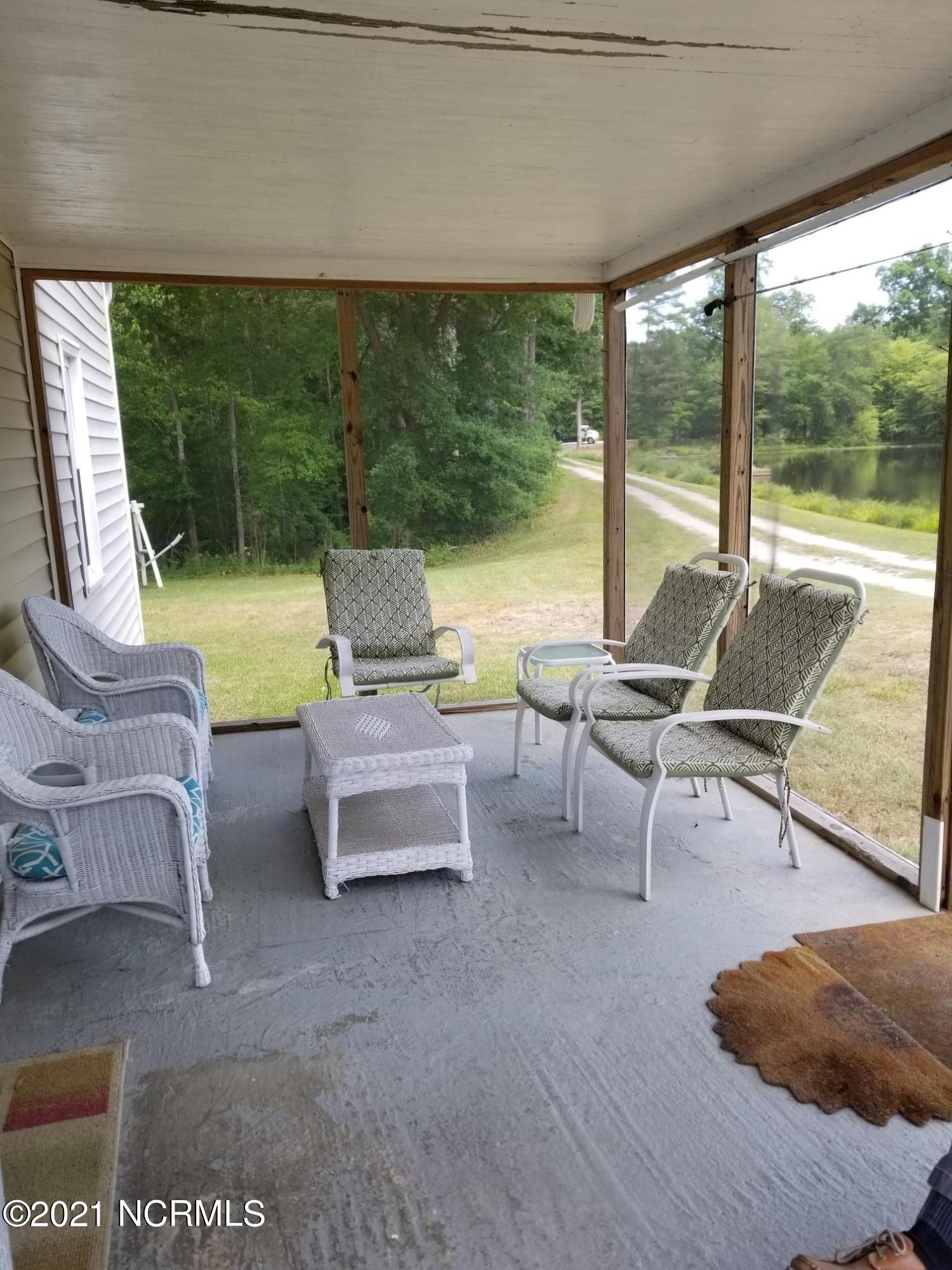 8324 Boy Scout Road Bailey, NC 27807 - Photo 36 of 44 screen porch overlooks pond