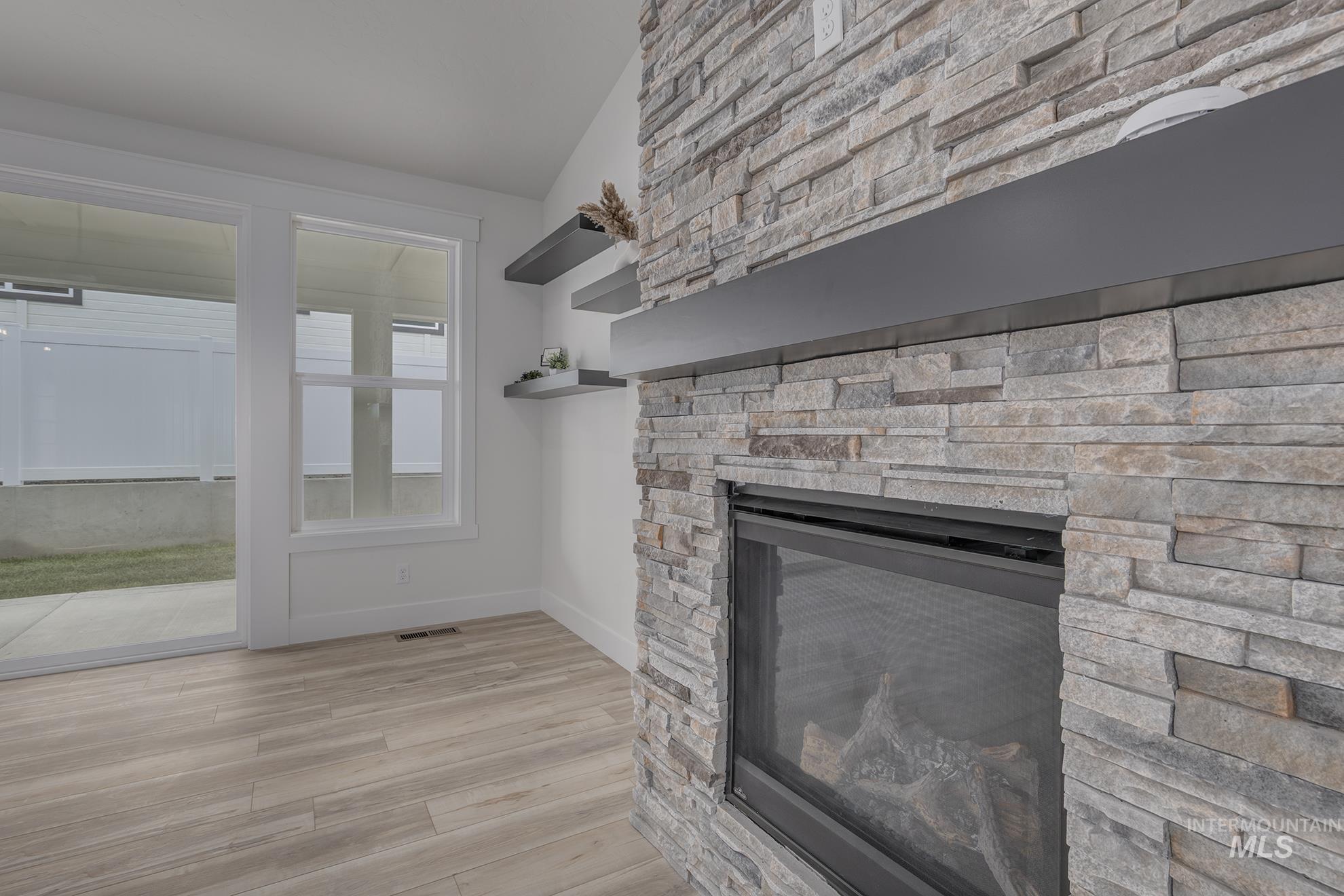 2810 Cypress Point Payette, ID 83661 - Photo 12 of 46 Detailed view of wood finished floors and a fireplace