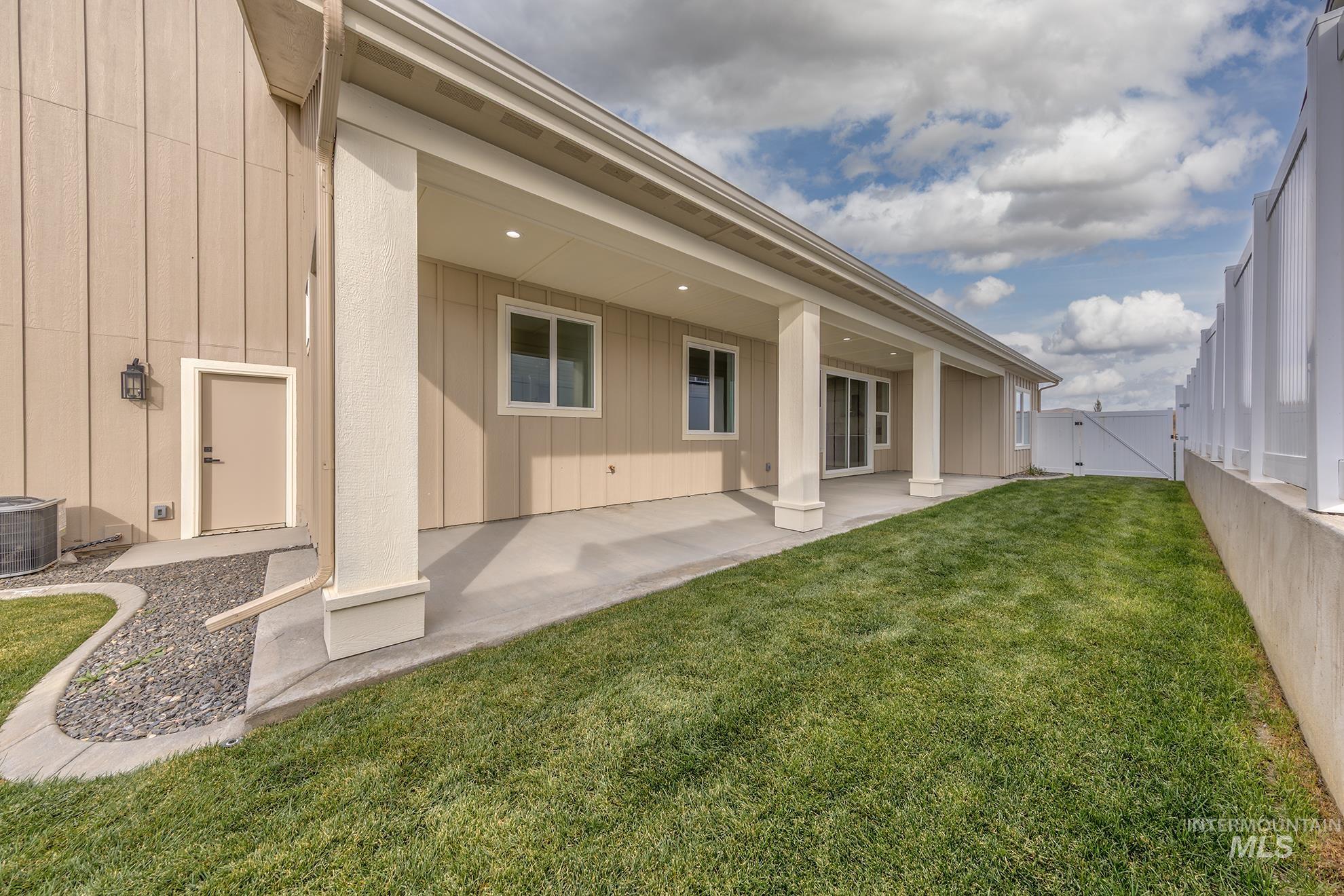 2810 Cypress Point Payette, ID 83661 - Photo 14 of 46 Rear view of house with a gate and a patio area