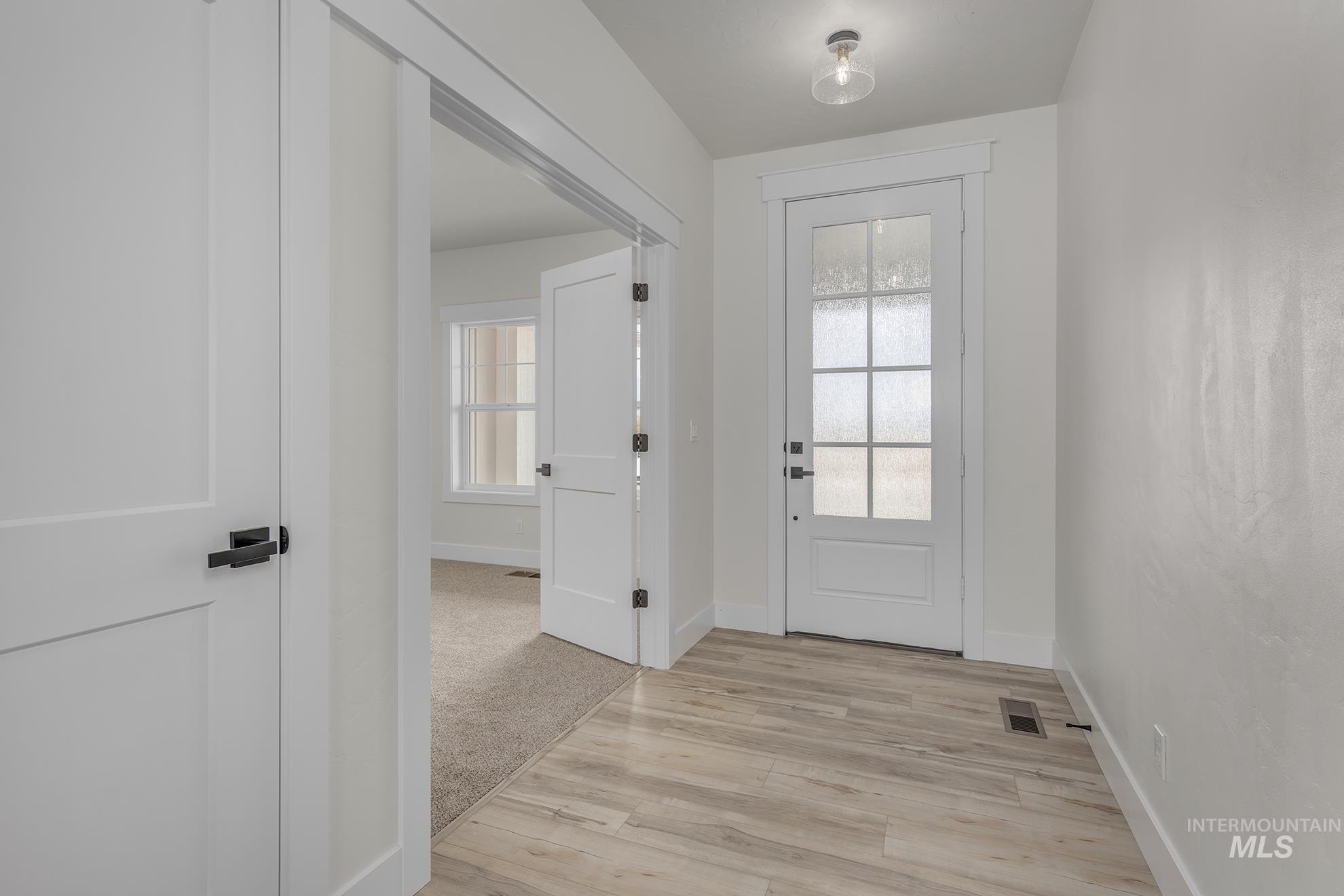 2810 Cypress Point Payette, ID 83661 - Photo 22 of 46 Doorway featuring plenty of natural light and wood finished floors