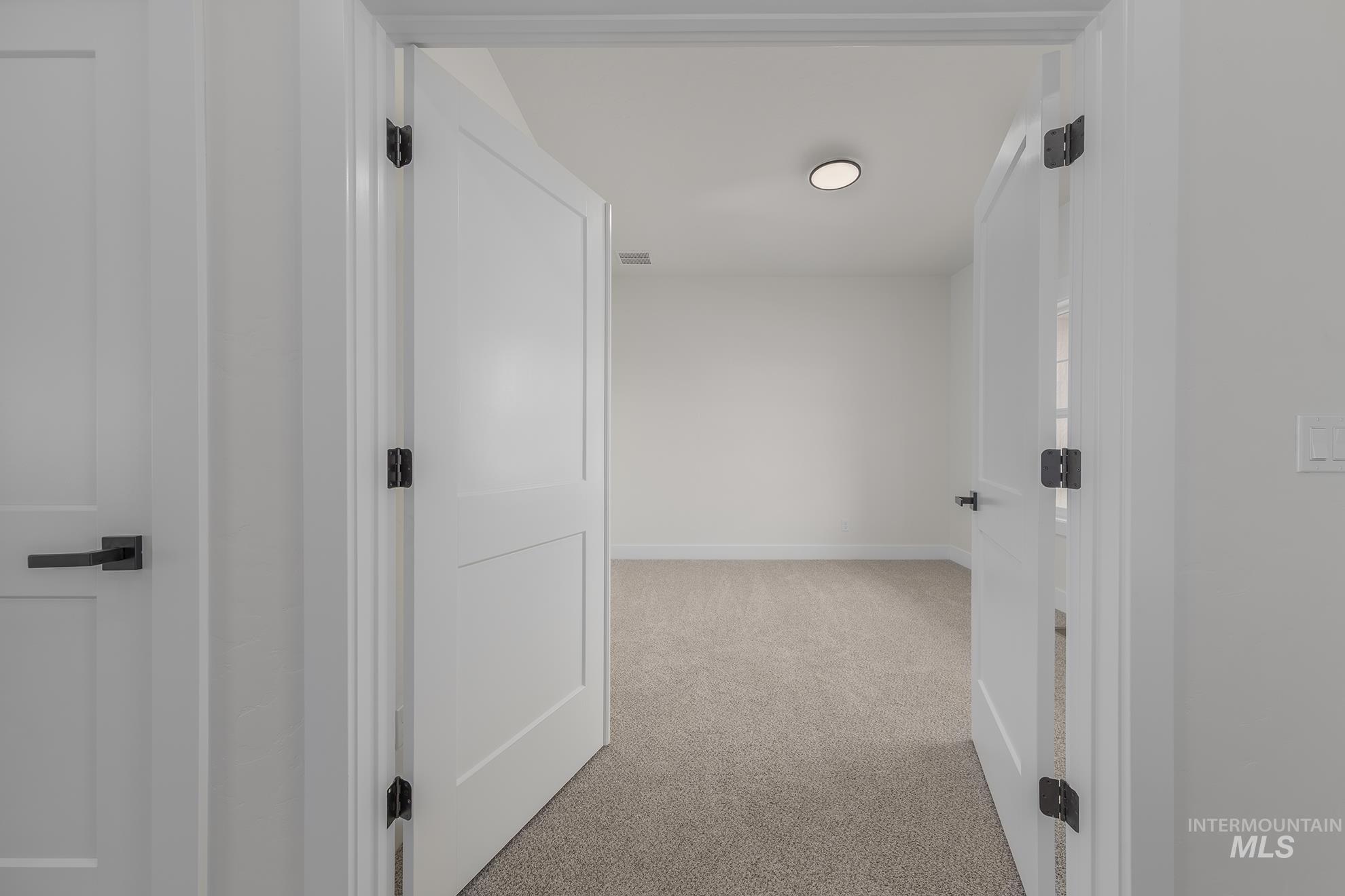 2810 Cypress Point Payette, ID 83661 - Photo 23 of 46 Corridor with light carpet and baseboards