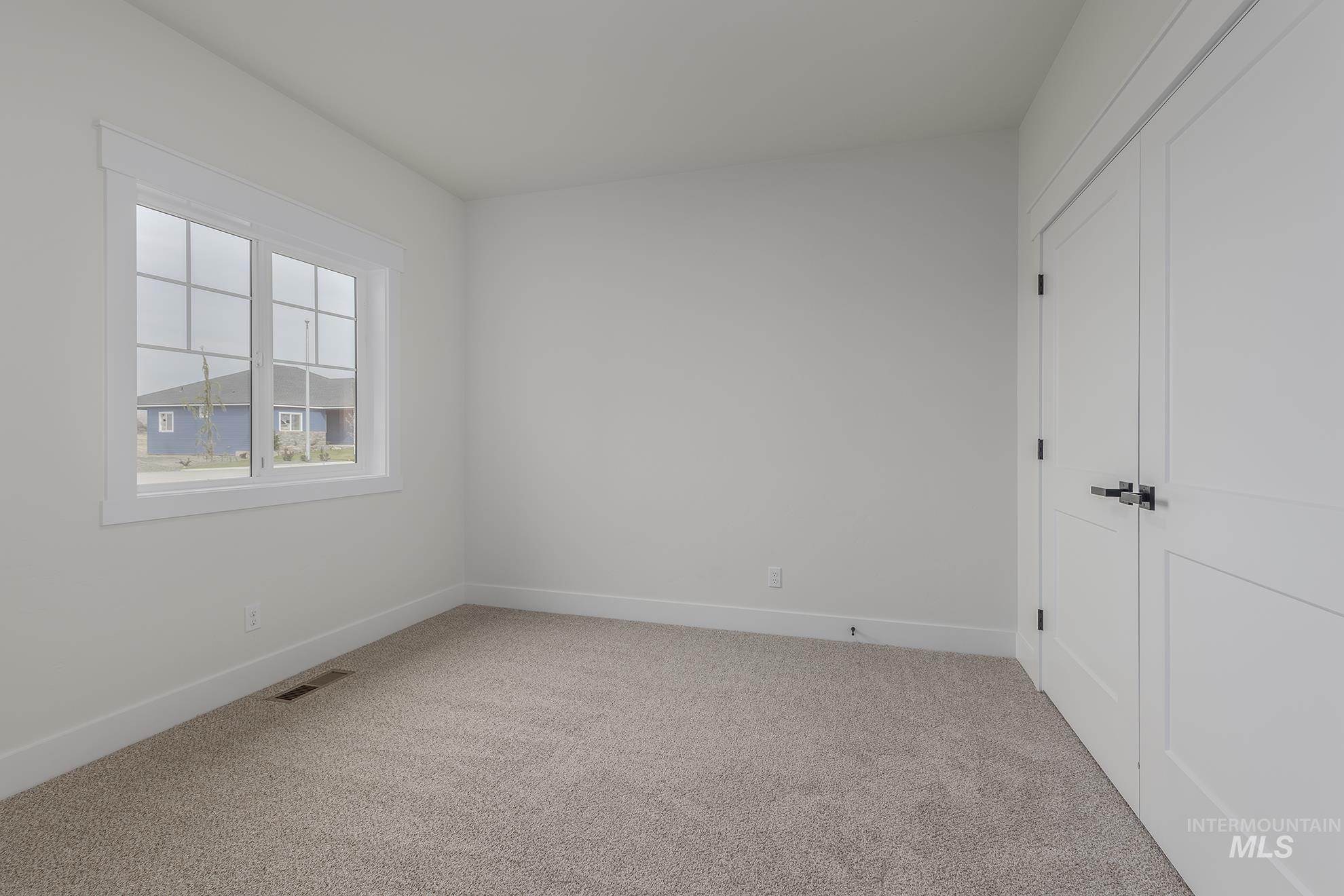 2810 Cypress Point Payette, ID 83661 - Photo 24 of 46 Unfurnished bedroom featuring light carpet and a closet