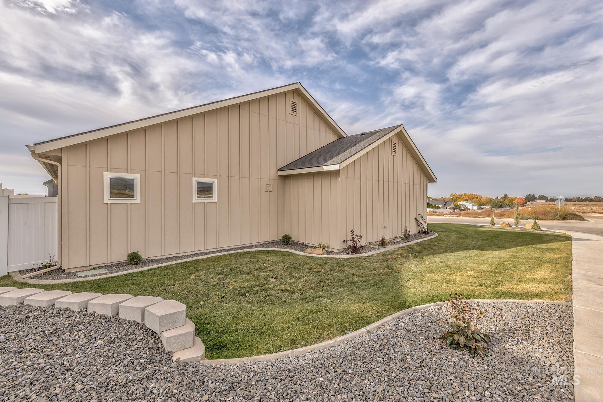 2810 Cypress Point Payette, ID 83661 - Photo 45 of 46 View of home's exterior with board and batten siding and a lawn