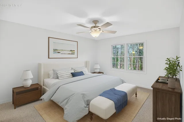 a bathroom with a granite countertop sink toilet a mirror and shower