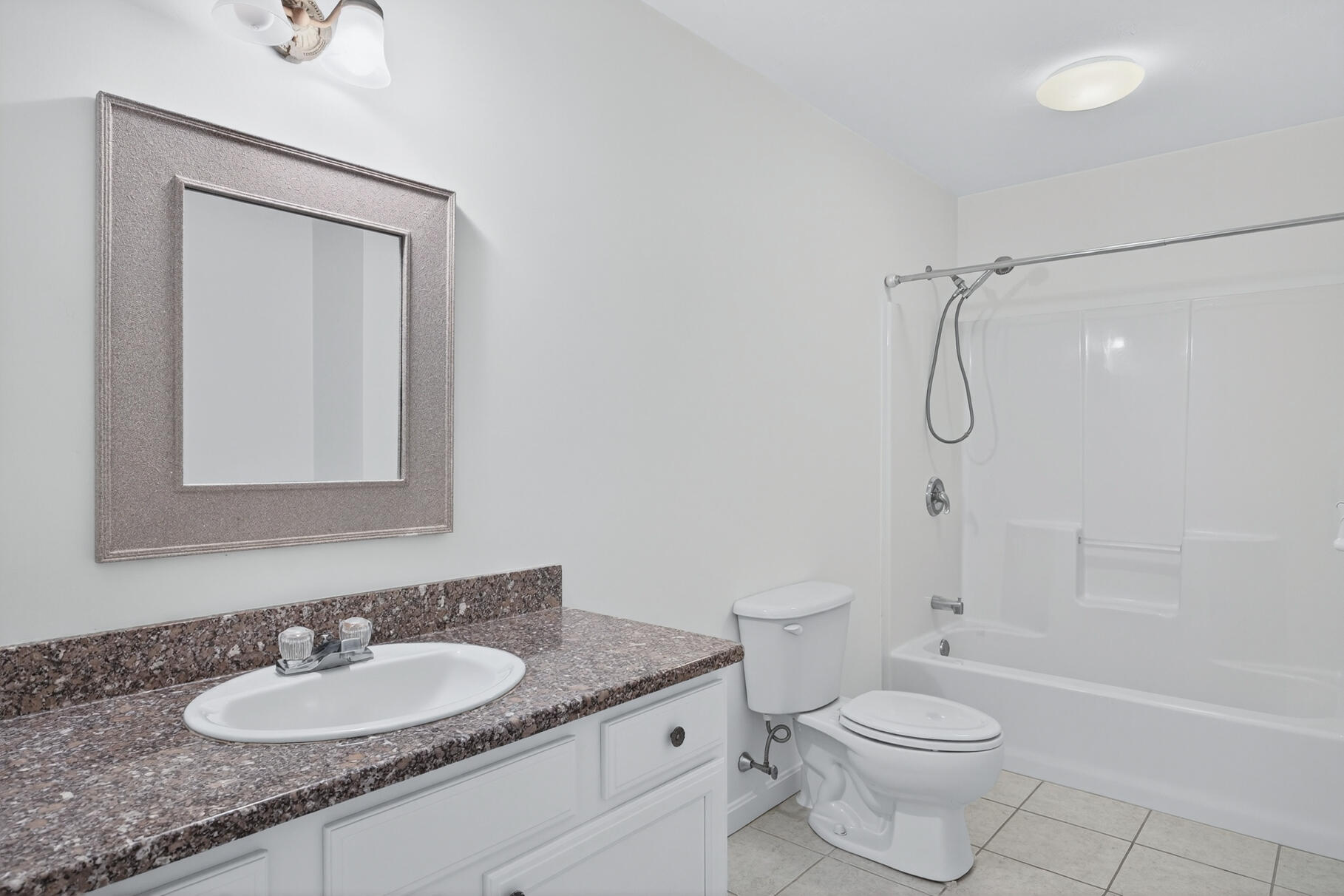 16 Gold Leaf Lane, Unit 16 Mashpee, MA 02649 - Photo 25 of 51 a bathroom with a granite countertop sink toilet a mirror and shower