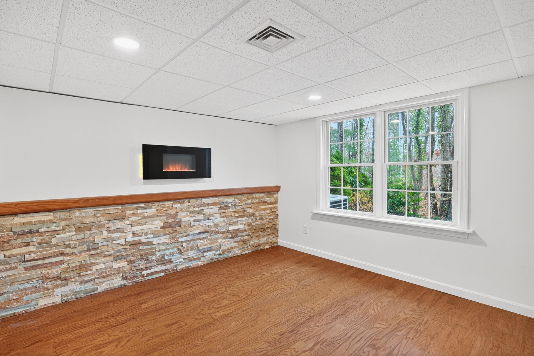 16 Gold Leaf Lane, Unit 16 Mashpee, MA 02649 - Photo 28 of 51 a view of an empty room with wooden floor and a window