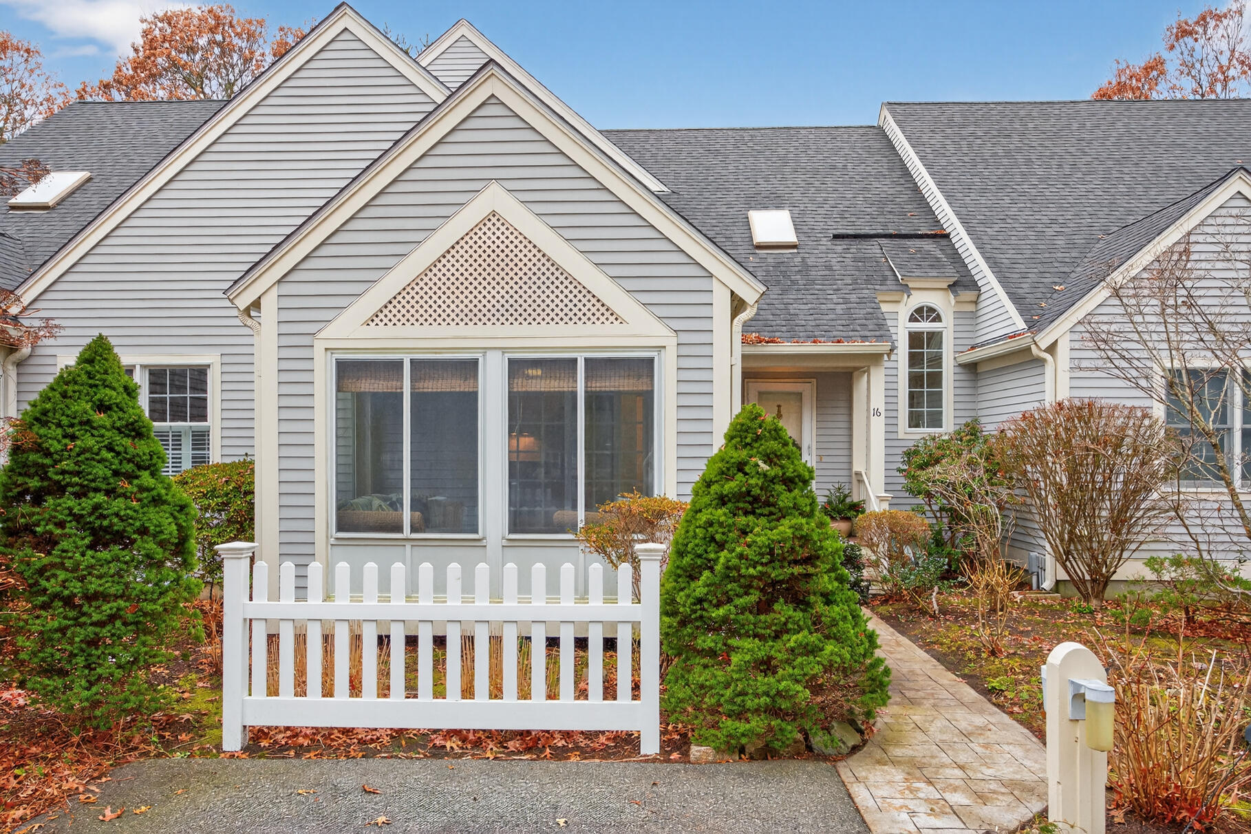 16 Gold Leaf Lane, Unit 16 Mashpee, MA 02649 - Photo 39 of 51 front view of a house with a yard