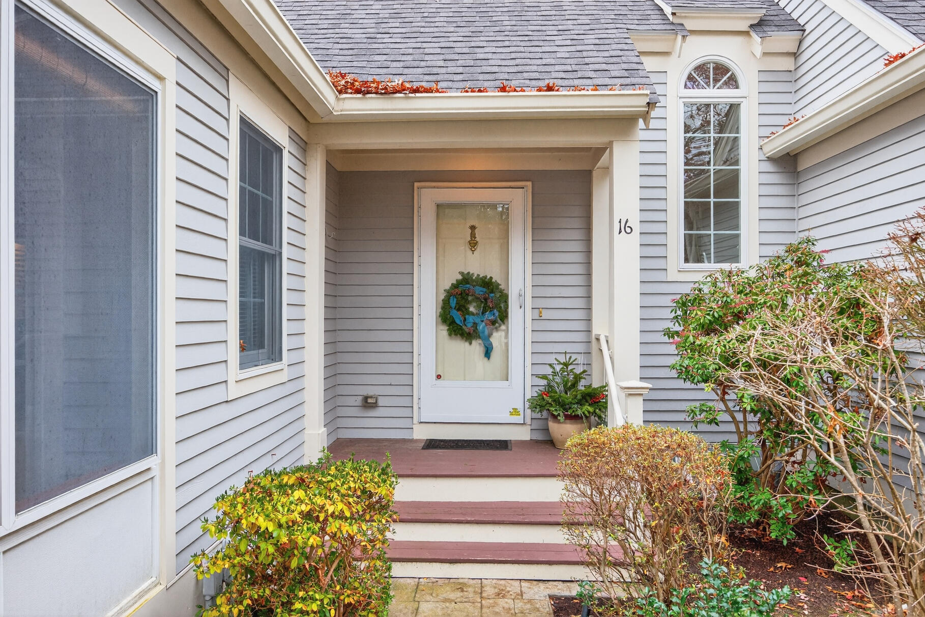 16 Gold Leaf Lane, Unit 16 Mashpee, MA 02649 - Photo 4 of 51 a front view of a house with a window