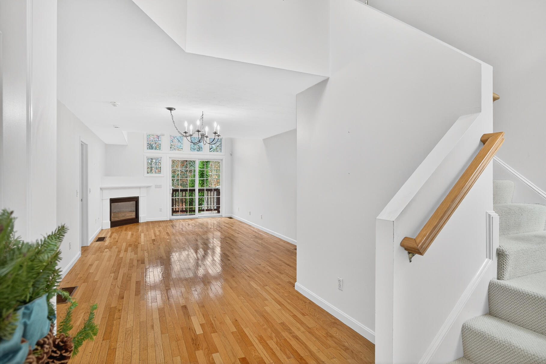 16 Gold Leaf Lane, Unit 16 Mashpee, MA 02649 - Photo 5 of 51 a view of empty room with wooden floor and fireplace