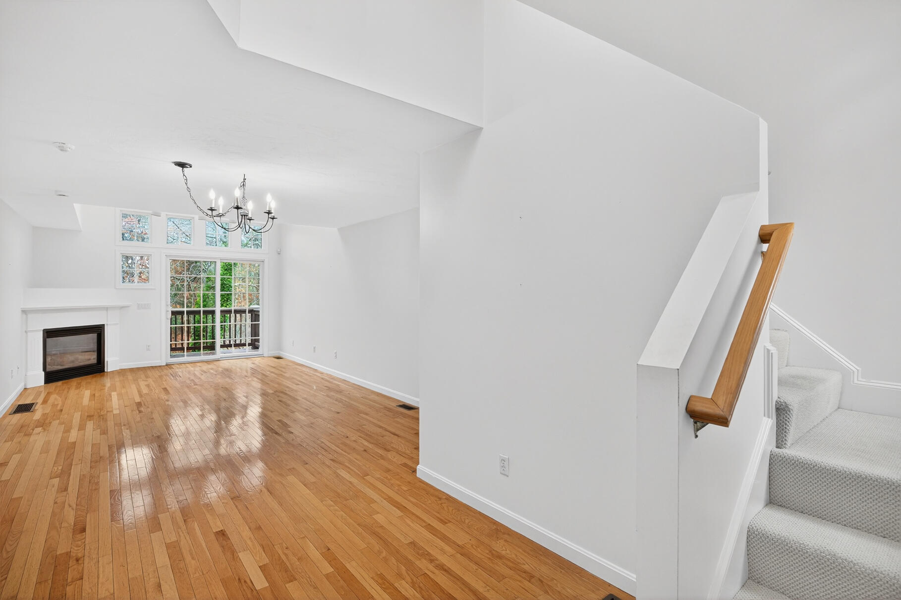 16 Gold Leaf Lane, Unit 16 Mashpee, MA 02649 - Photo 7 of 51 a view of empty room with fireplace and wooden floor