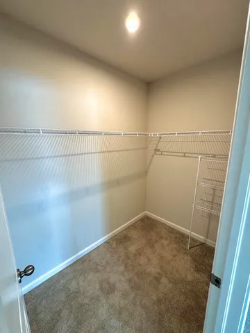 a view of a house with a yard porch and sitting area