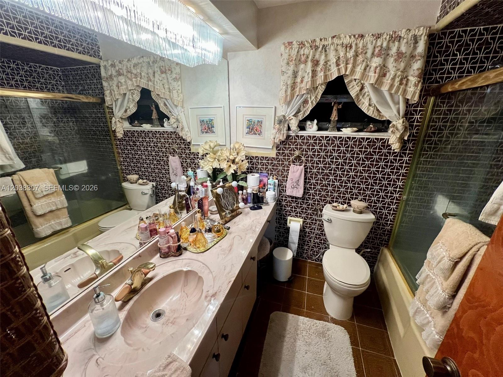9601 Southwest 66th Street Miami, FL 33173 - Photo 24 of 62 a bathroom with a sink toilet and shower