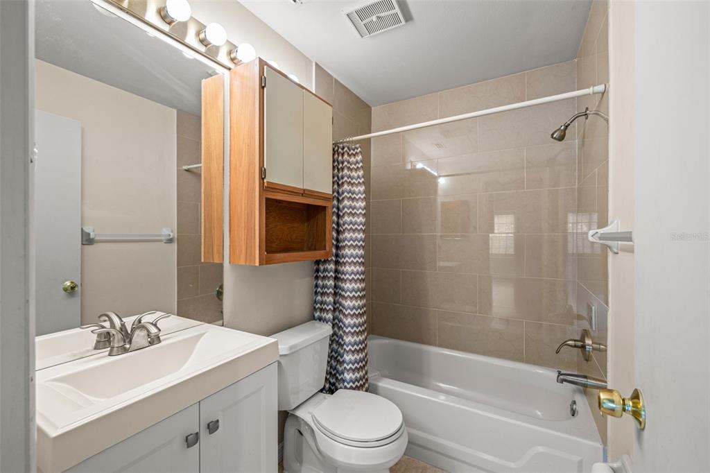 5100 Burchette Road, Unit 300 Tampa, FL 33647 - Photo 18 of 27 a bathroom with a sink toilet tub and shower