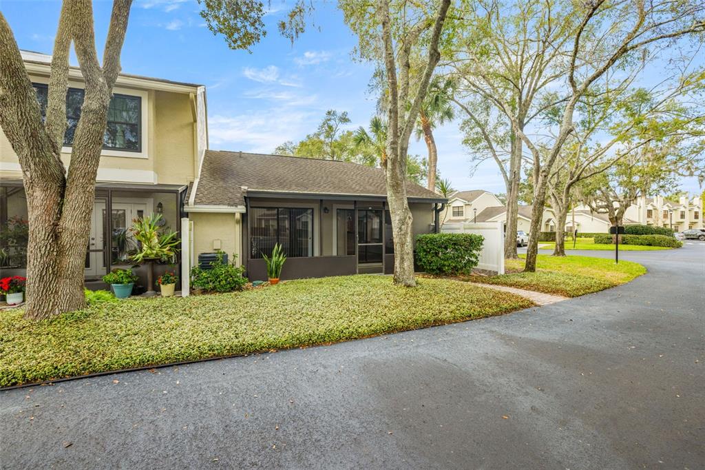 5100 Burchette Road, Unit 300 Tampa, FL 33647 - Photo 21 of 27 a view of a house with a yard and potted plants