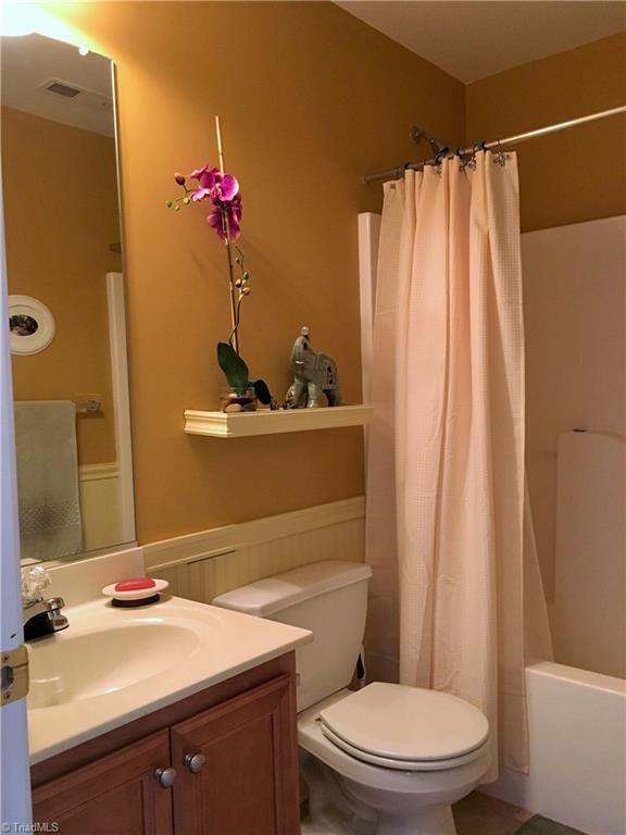 6028 Evans Mill Road High Point, NC 27265 - Photo 14 of 22 Guest bath is also nicely completed with tile flooring.