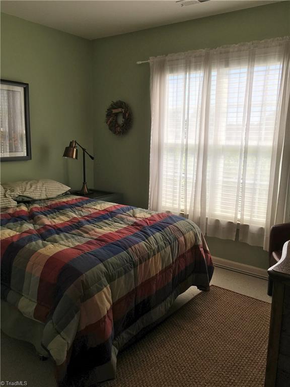 6028 Evans Mill Road High Point, NC 27265 - Photo 16 of 22 Second bedroom is a good size and offers natural light.