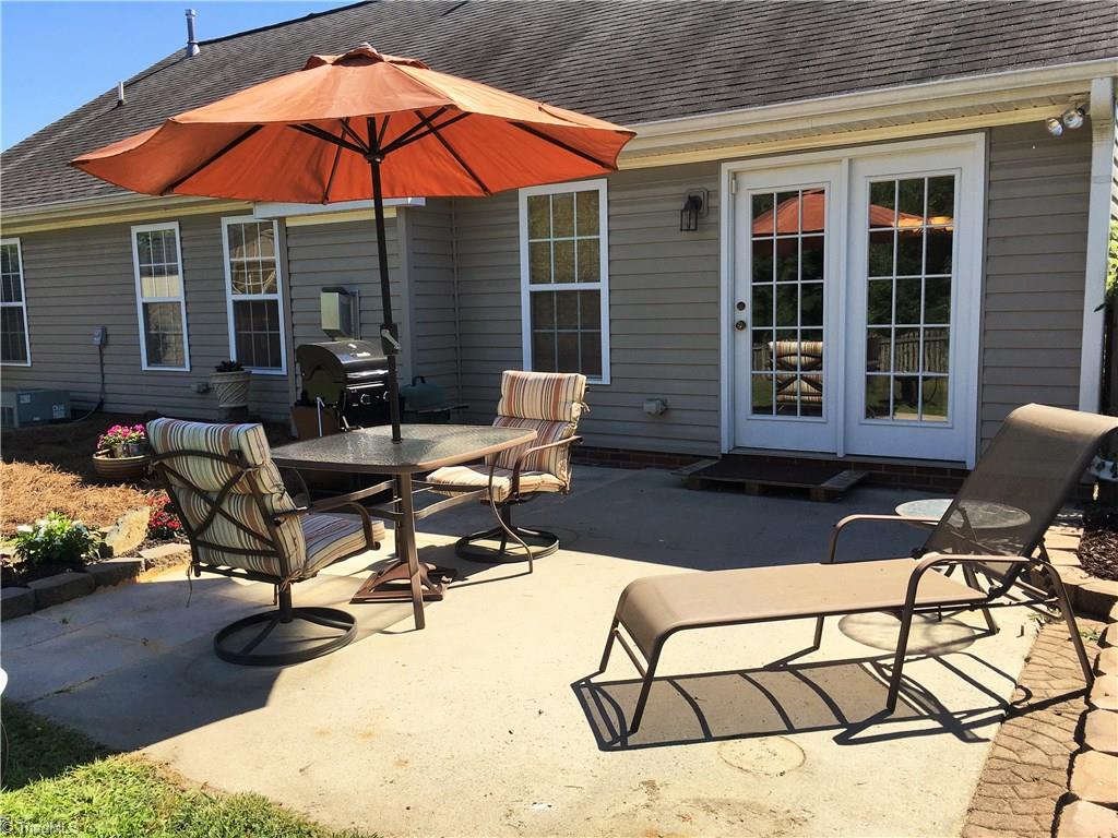6028 Evans Mill Road High Point, NC 27265 - Photo 21 of 22 Entertain? This is perfect. Patio has been extended to offer lots of seating and BBQ area.