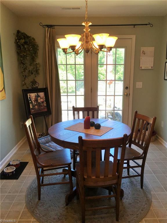 6028 Evans Mill Road High Point, NC 27265 - Photo 6 of 22 Dining room has lots of space and french doors to patio for grilling and fun!