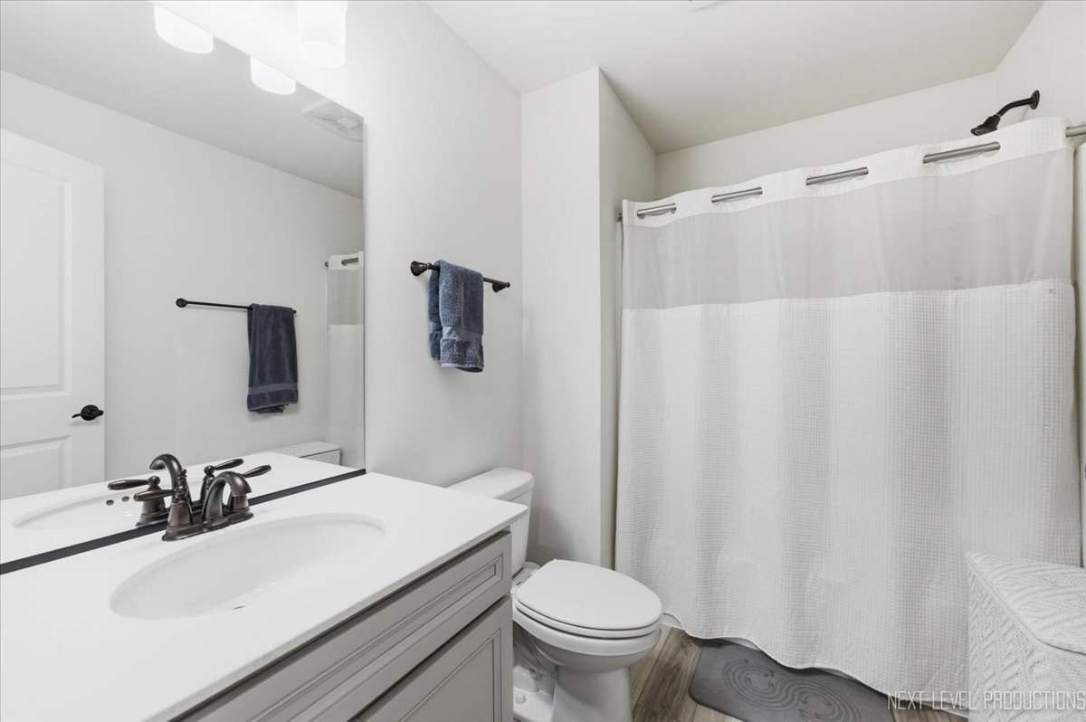 2132 Weatherbee Lane Naperville, IL 60563 - Photo 14 of 23 a bathroom with a sink and a mirror