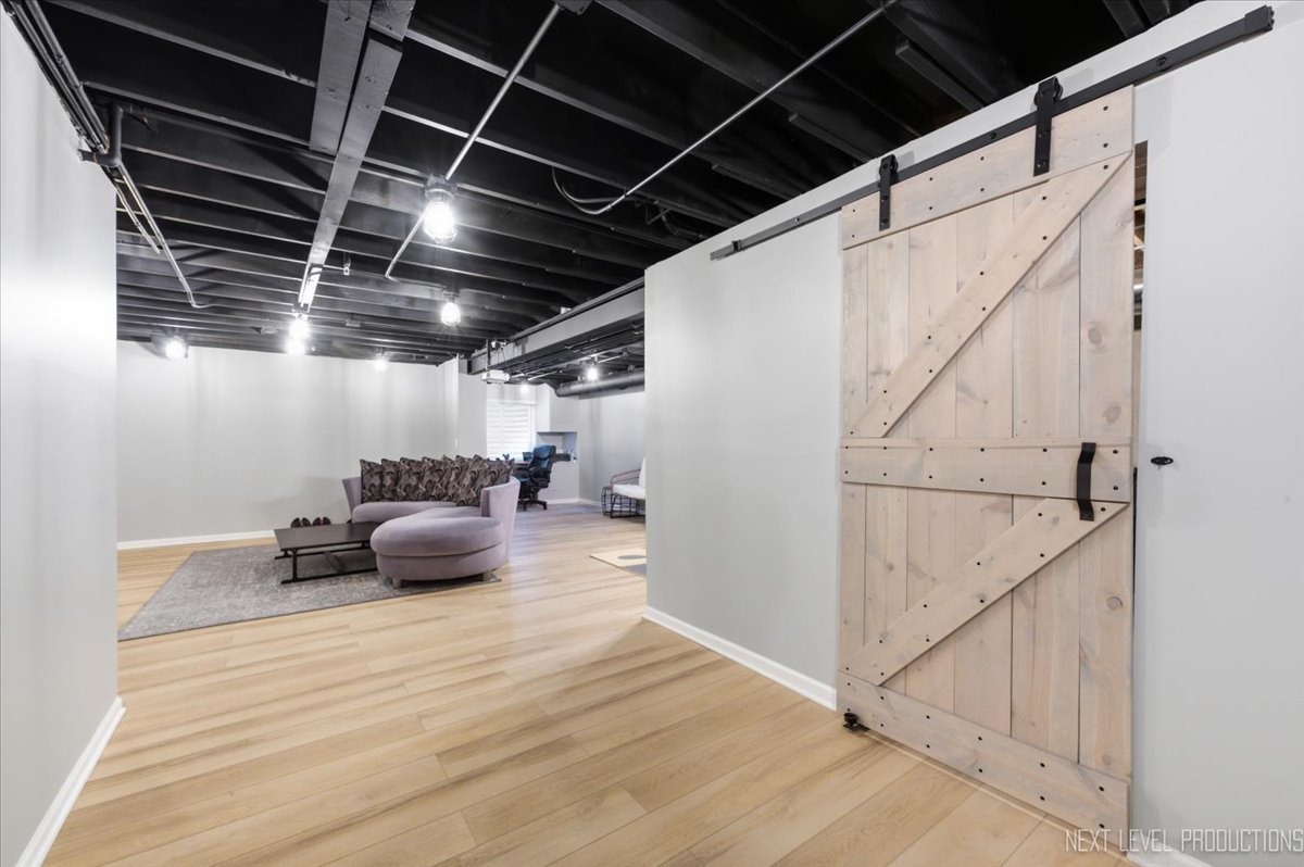 2132 Weatherbee Lane Naperville, IL 60563 - Photo 15 of 23 a view of water heater and stairs