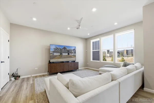 a spacious bedroom with a large bed and a large window