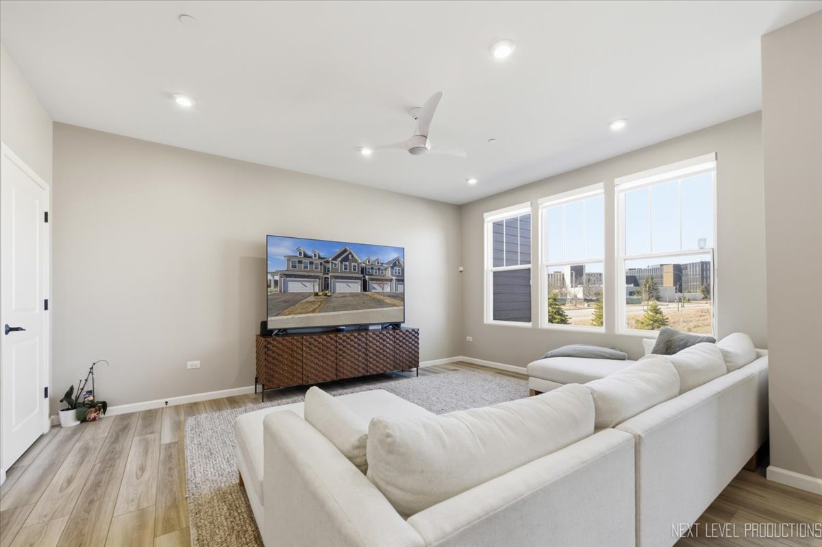 2132 Weatherbee Lane Naperville, IL 60563 - Photo 5 of 23 a spacious bedroom with a large bed and a large window