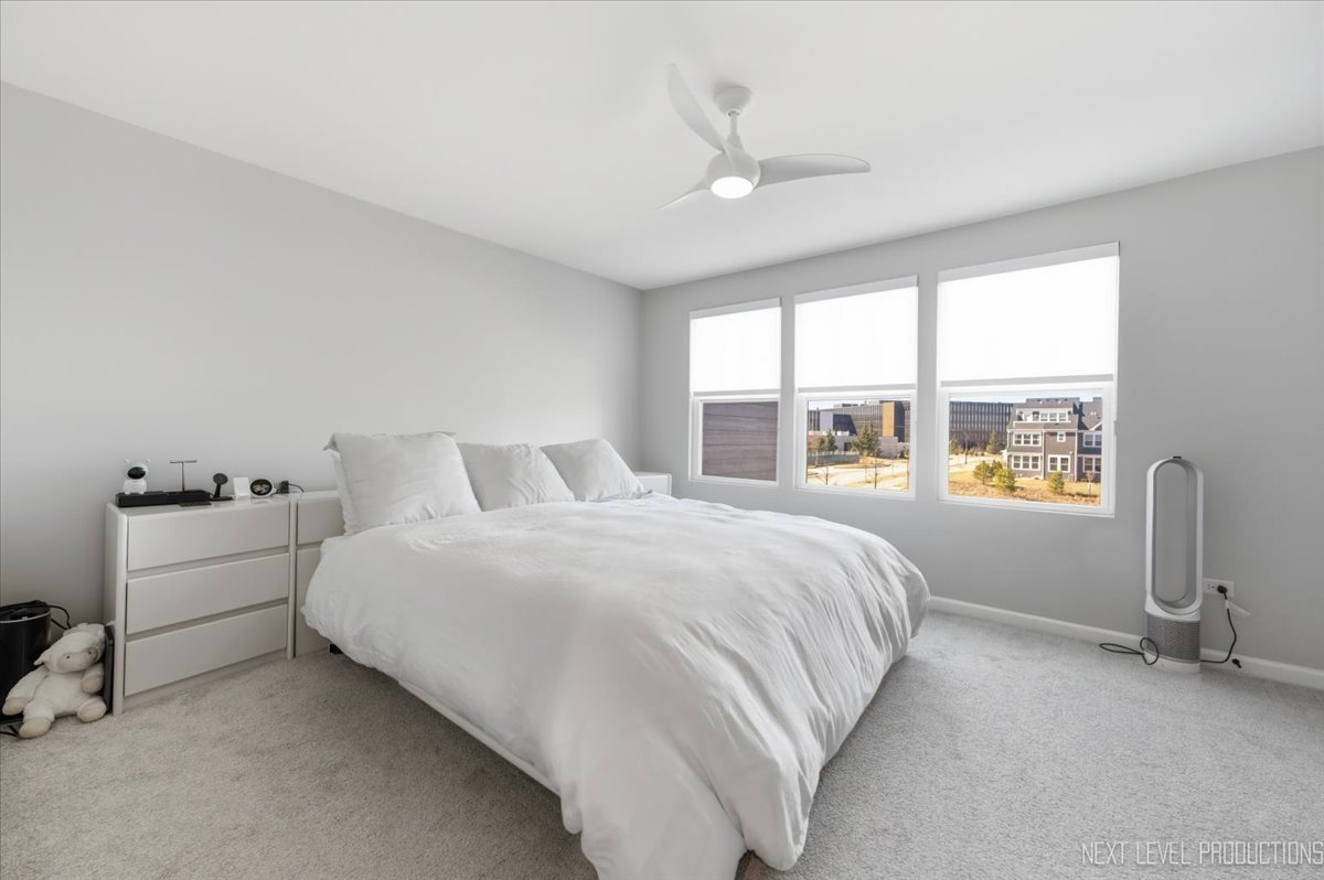 2132 Weatherbee Lane Naperville, IL 60563 - Photo 10 of 23 a bedroom with a bed and a large window