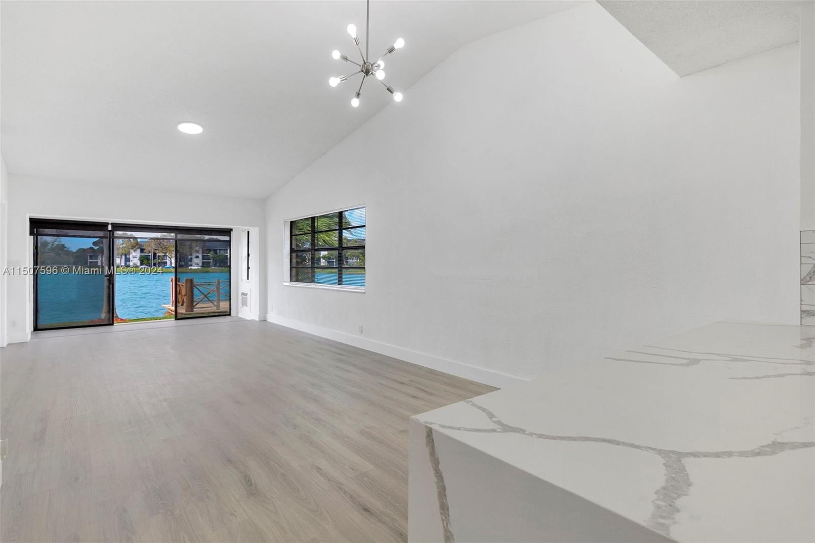 645 Banks Road Margate, FL 33063 - Photo 17 of 38 a view of an empty room with a window