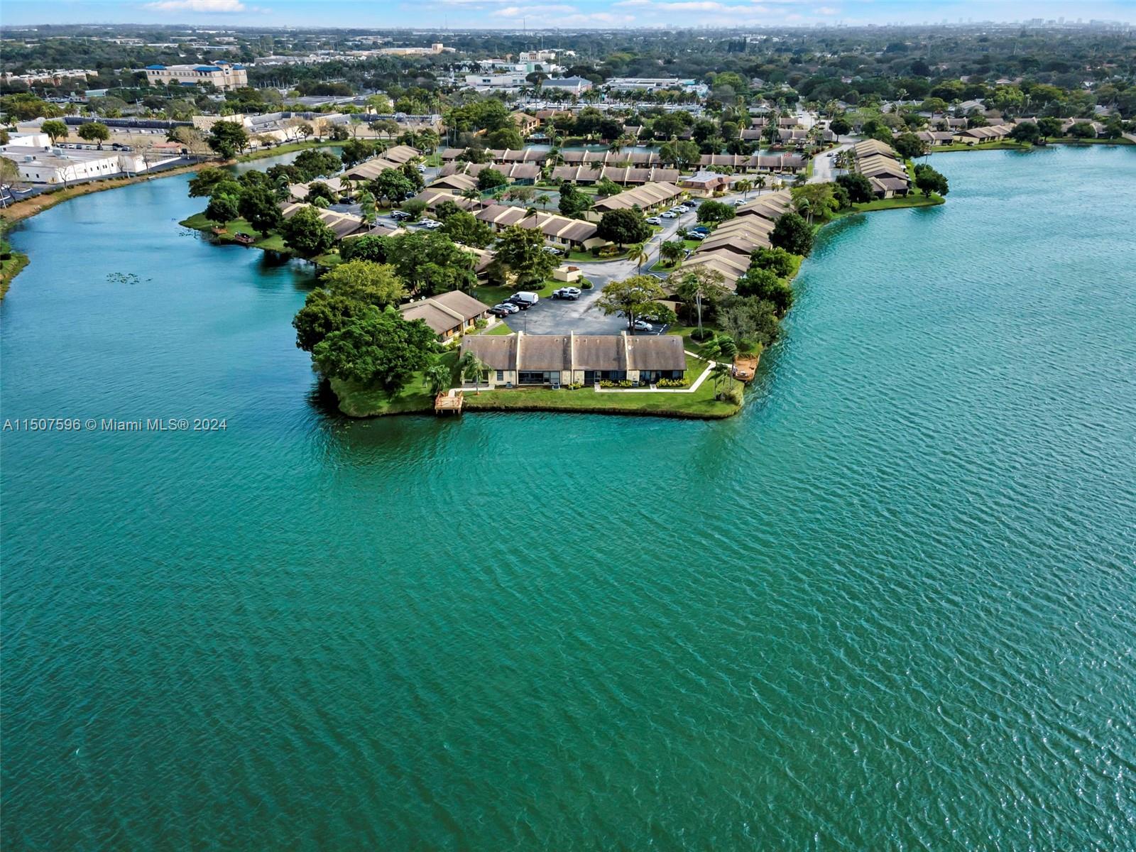 645 Banks Road Margate, FL 33063 - Photo 2 of 38 an aerial view of a residential houses with outdoor space and trees all around