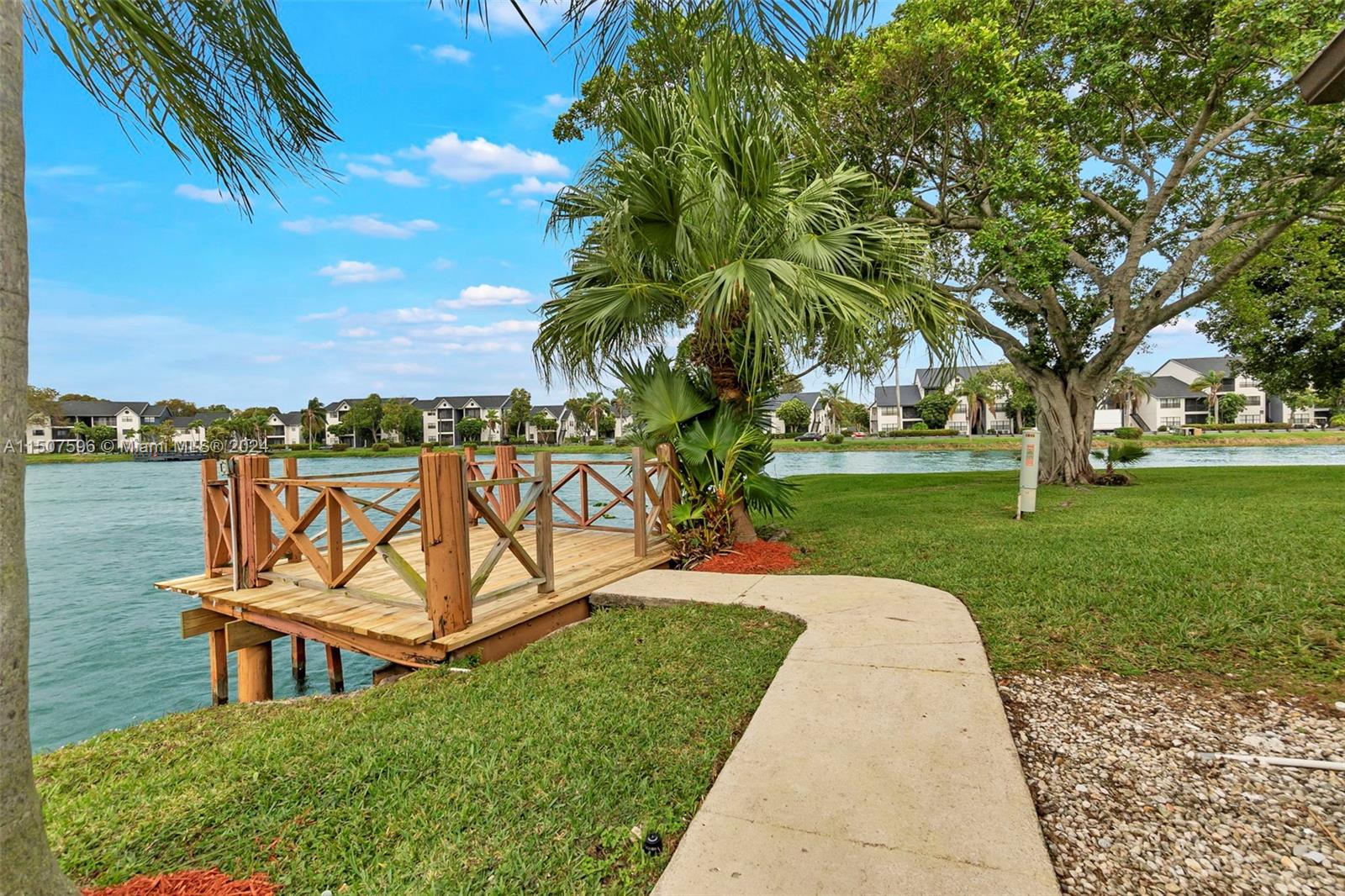 645 Banks Road Margate, FL 33063 - Photo 29 of 38 a view of a park with bench and trees