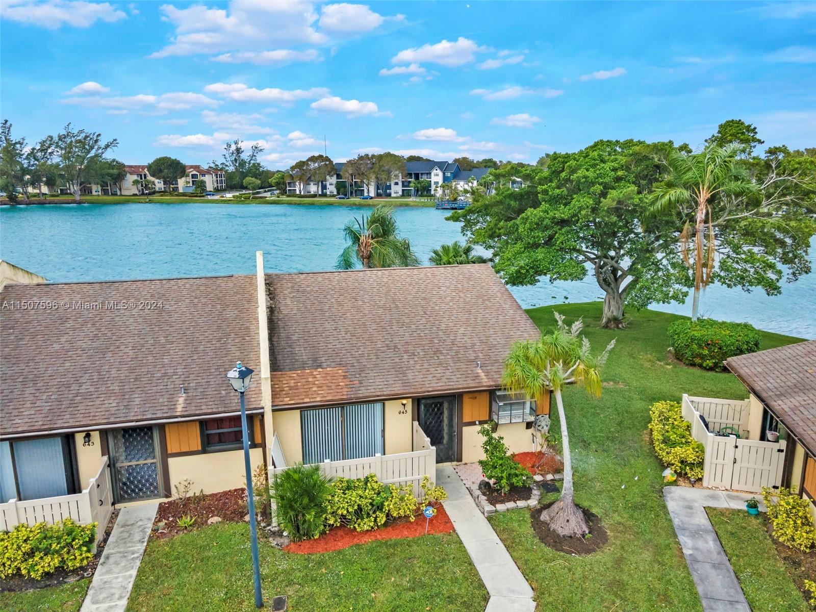 645 Banks Road Margate, FL 33063 - Photo 4 of 38 an aerial view of house with a garden and lake view