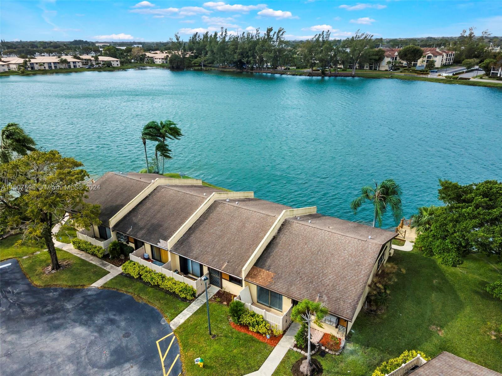 645 Banks Road Margate, FL 33063 - Photo 5 of 38 an aerial view of a house with a lake view