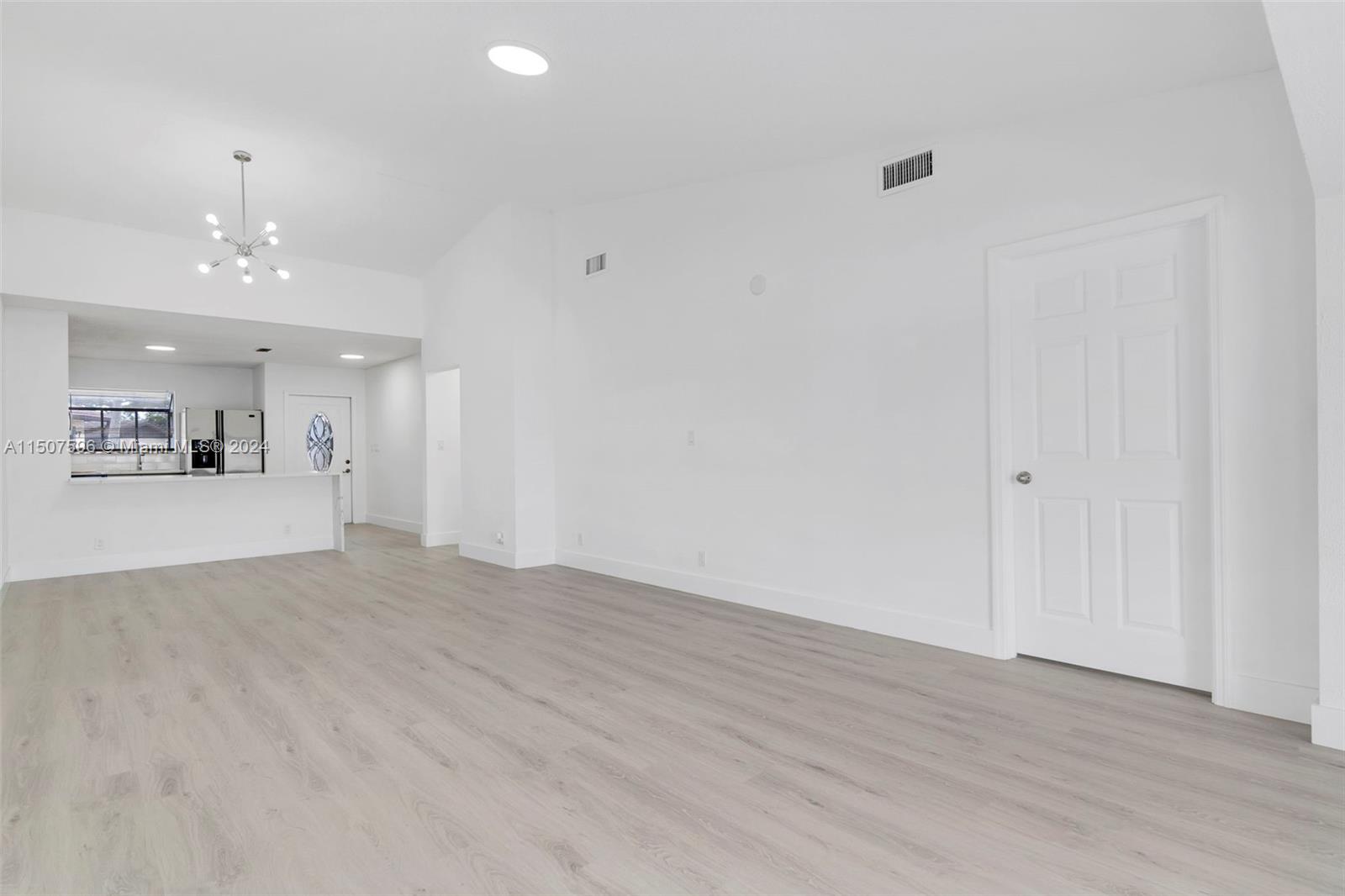 645 Banks Road Margate, FL 33063 - Photo 10 of 38 wooden floor in an empty room