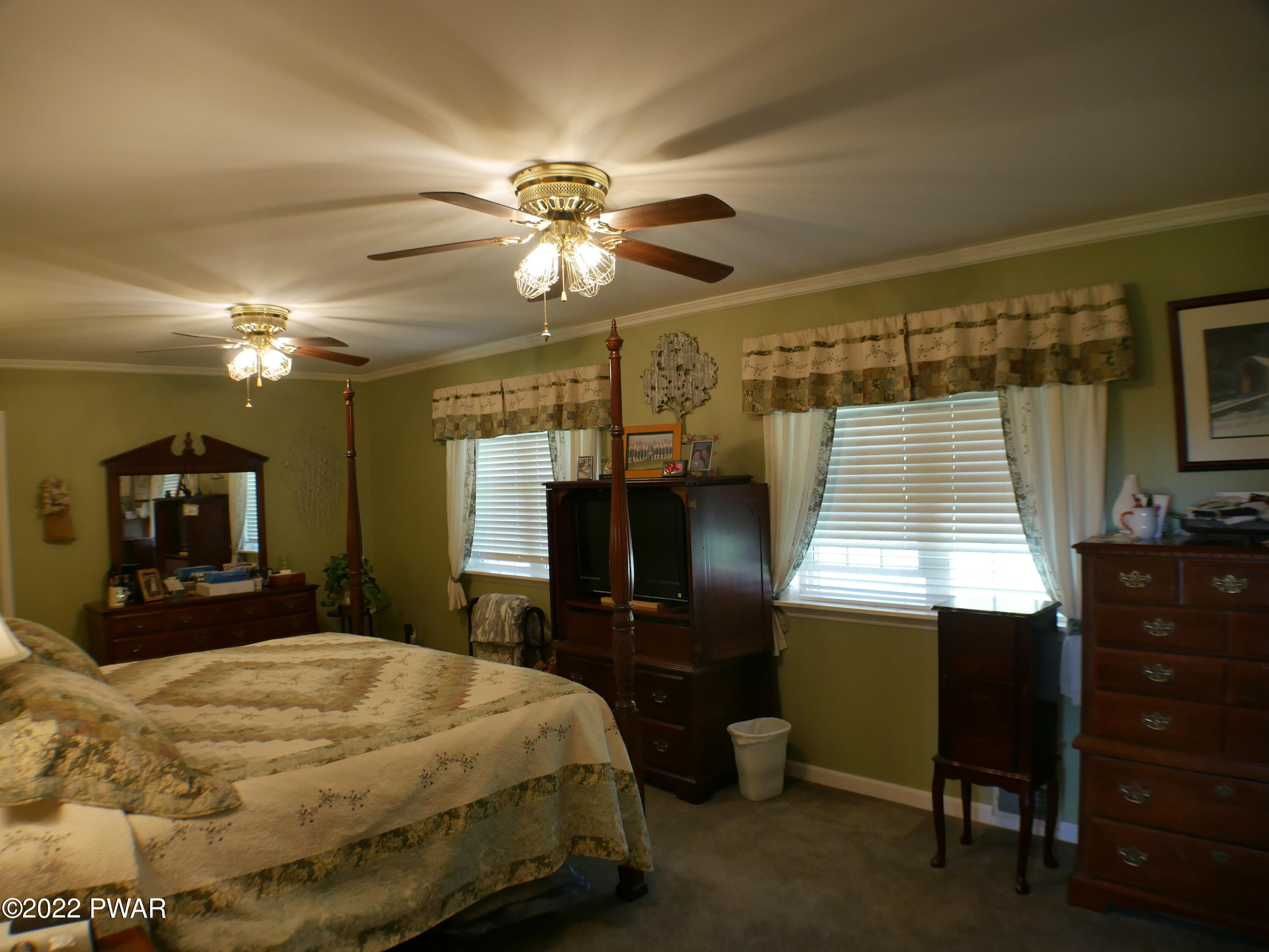 1259 Dougherty Road Meshoppen, PA 18630 - Photo 21 of 61 a bedroom with a bed and a chandelier