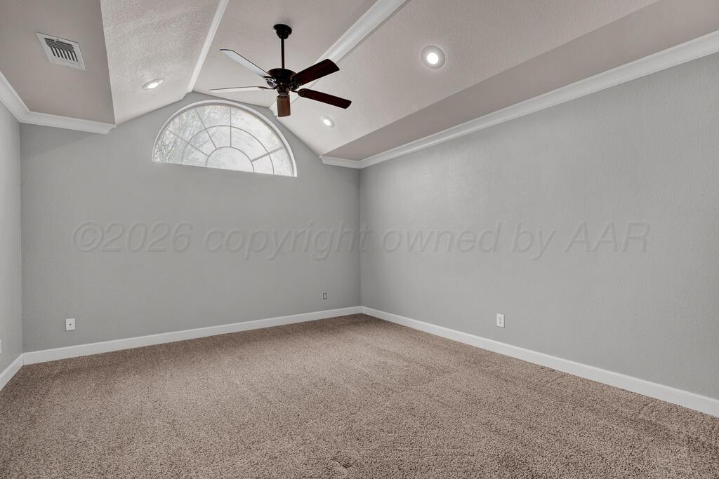 19933 Indian Spring Trail Bushland, TX 79124 - Photo 18 of 32 an empty room with a chandelier fan and windows