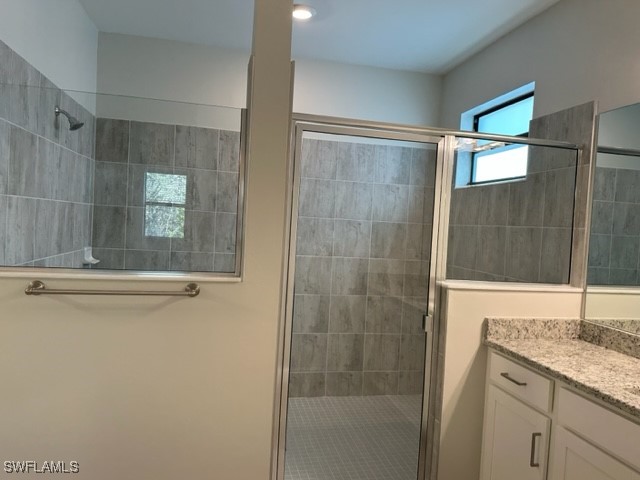 11156 Canopy Loop Fort Myers, FL 33913 - Photo 12 of 47 a bathroom with a granite countertop bathtub shower sink and mirror