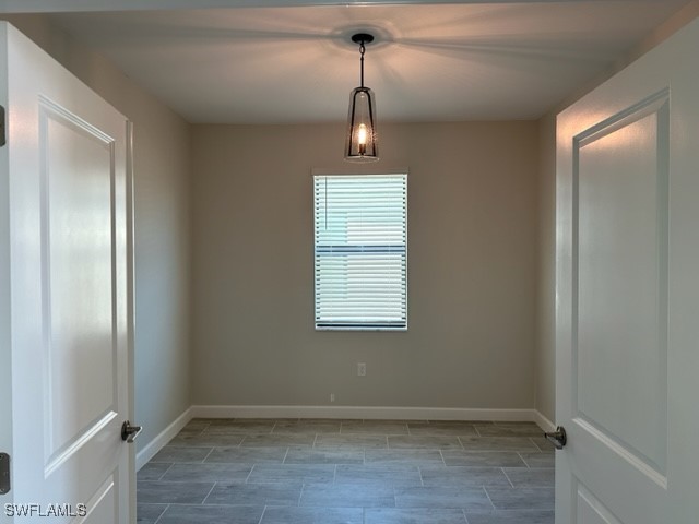 11156 Canopy Loop Fort Myers, FL 33913 - Photo 15 of 47 a view of an empty room with wooden floor window and a mirror