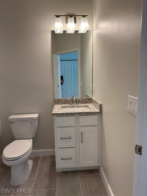 11156 Canopy Loop Fort Myers, FL 33913 - Photo 19 of 47 a bathroom with a toilet sink and mirror