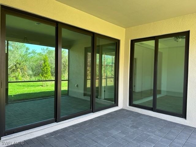 11156 Canopy Loop Fort Myers, FL 33913 - Photo 21 of 47 a view of backyard with large windows