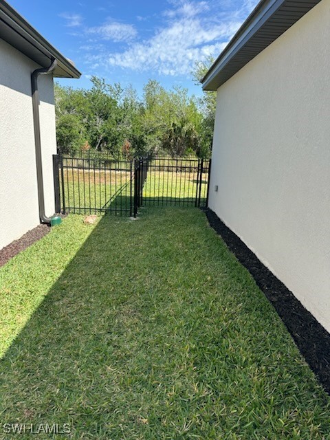11156 Canopy Loop Fort Myers, FL 33913 - Photo 24 of 47 a view of a yard with a trees in the background