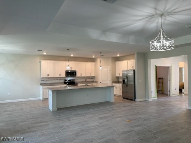 11156 Canopy Loop Fort Myers, FL 33913 - Photo 3 of 47 a kitchen with stainless steel appliances a refrigerator sink and stove