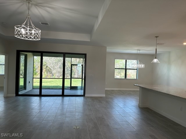 11156 Canopy Loop Fort Myers, FL 33913 - Photo 4 of 47 an empty room with wooden floor and windows