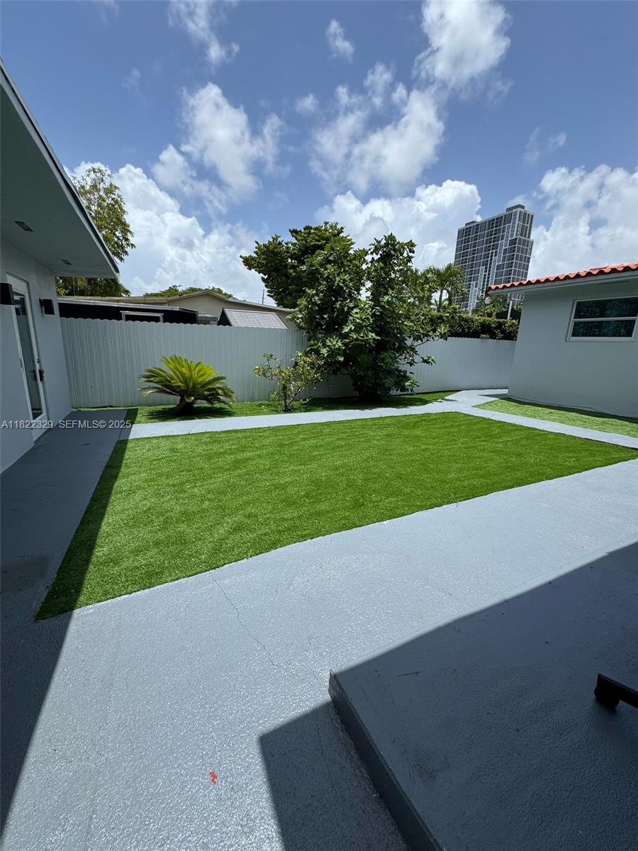 2941 Southwest 36th Avenue, Unit A Miami, FL 33133 - Photo 20 of 23 a view of a stadium that has a big yard