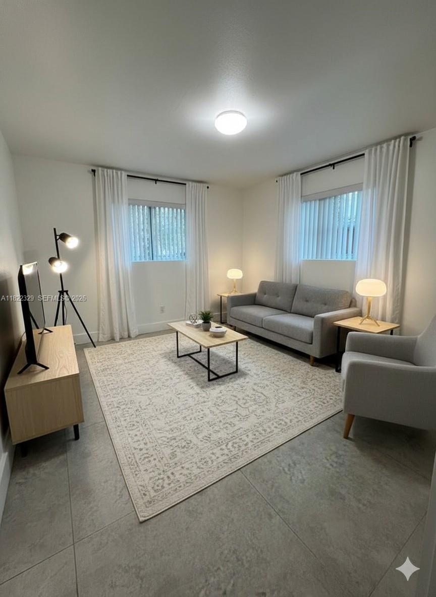 2941 Southwest 36th Avenue, Unit A Miami, FL 33133 - Photo 3 of 21 a living room with furniture and a window