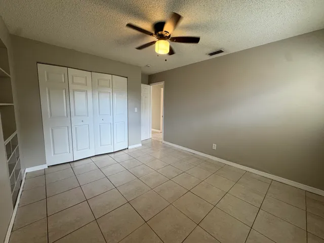 a view of an empty room and cabinet