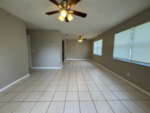 a view of an empty room and window